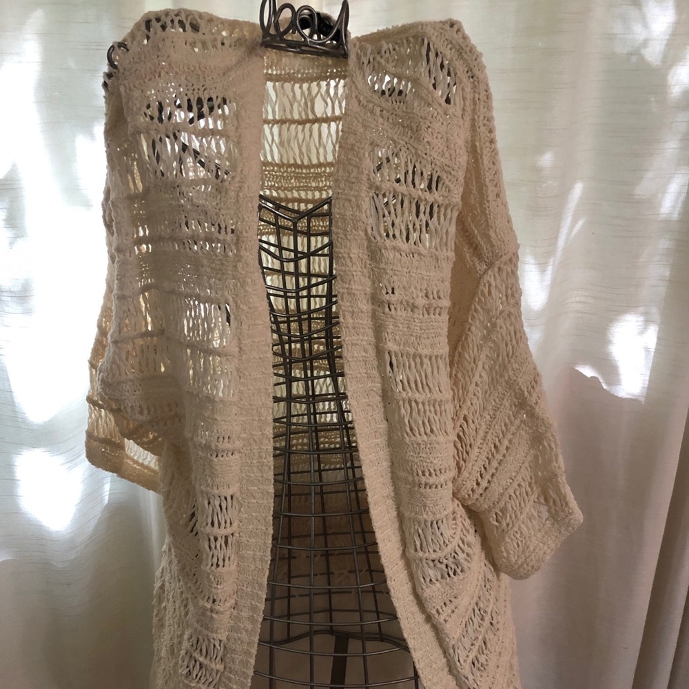Open weave sweater with fringe
